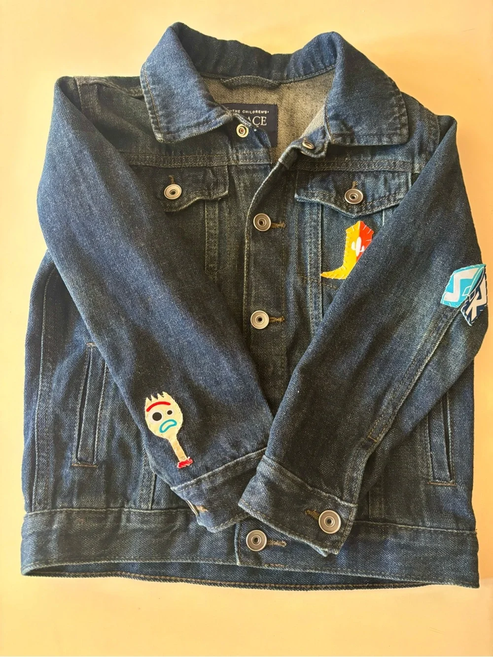 Boys Dark Blue Denim Jacket with hand sewn on Toy Story Patches